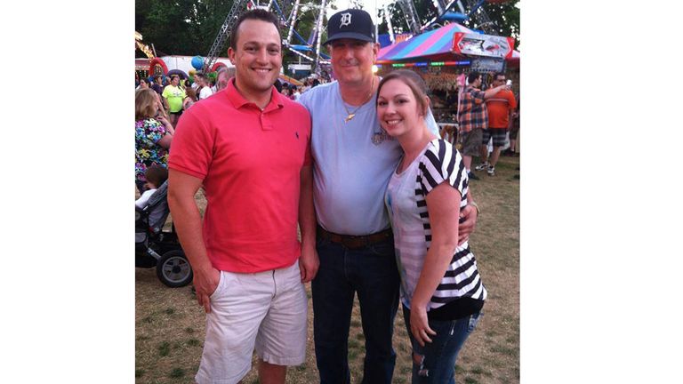 This photo provided by the family shows from left, David Bennett Jr., David Bennett Sr., and Nicole (Bennett) McCray at a carnival in 2014. In a medical first, doctors transplanted a pig heart into Bennett Sr., in a last-ditch effort to save his life and the hospital said Monday, Jan. 10, 2022 that he&#39;s doing well three days after the highly experimental surgery. (Courtesy David Bennett Jr. via AP)


