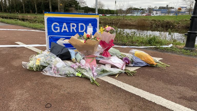 Flowers and messages left at a Garda checkpoint in Tullamore after a young woman, who has been named locally as Ashling Murphy, was killed on Wednesday evening. She died after being attacked while she was jogging along the canal bank at Cappincur at around 4pm on Wednesday. Issue date: Thursday January 13, 2022.

