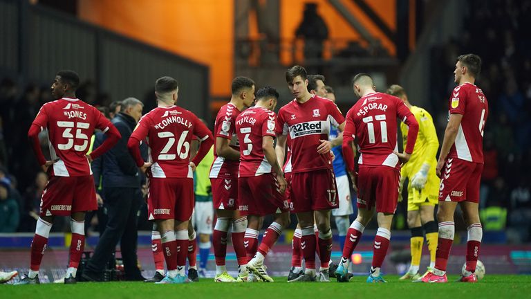 Middlesbrough players wait as play is paused due to a medical emergency in the stands during the Sky Bet Championship match at Ewood Park, Blackburn. Picture date: Monday January 24, 2022.
