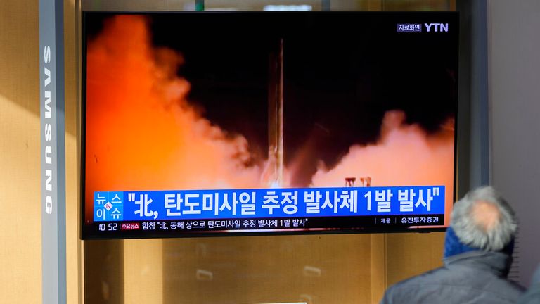A news programme reports about North Korea&#39;s missile with file footage at a train station in Seoul, South Korea