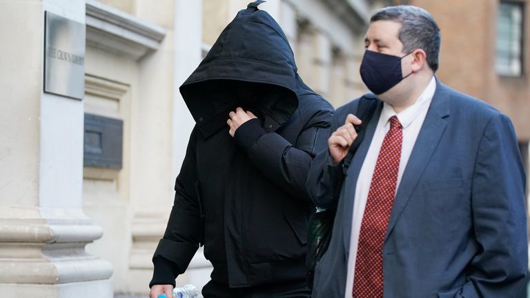 Nathan Smith (L) arriving at court accompanied by a member of his legal team 