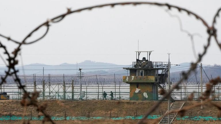 South Korean army soldiers patrol along the barbed-wire fence in Paju, near the border with North Korea, on Wednesday