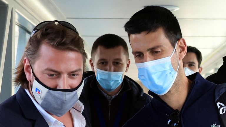 Serbian tennis player Novak Djokovic arrives at Nikola Tesla Airport, after the Australian Federal Court upheld a government decision to cancel his visa to play in the Australian Open, in Belgrade, Serbia January 17, 2022. REUTERS/Christopher Pike
