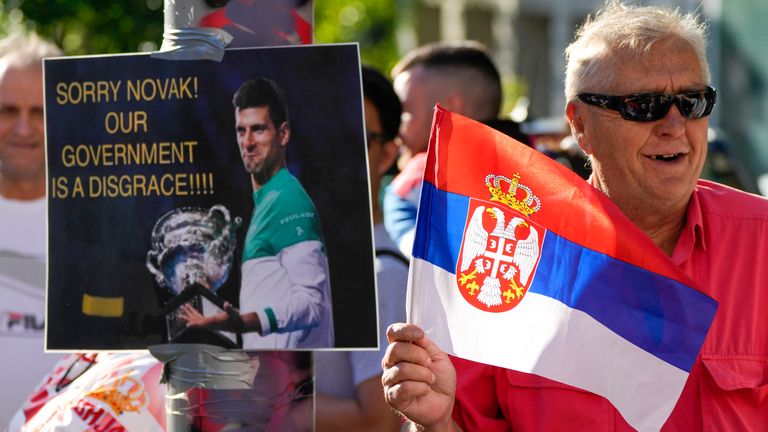 supporters of Serbia...s Novak Djokovic wait outside the Park Hotel, used as an immigration detention hotel where Djokovic is confined in Melbourne, Australia, Sunday, Jan. 9, 2022. After four nights in hotel detention Novak Djokovic will get his day in court on Monday in a controversial immigration case that has polarized opinions in the tennis world and elicited heartfelt support for the star back home in his native Serbia.(AP Photo/Mark Baker)