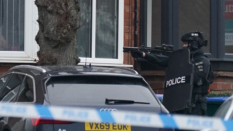 Armed officers have been seen outside the property as the stand-off enters its third day