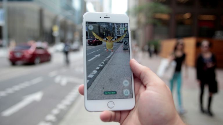 A "Pidgey" Pokemon is seen on the screen of the Pokemon Go mobile app, Nintendo&#39;s new scavenger hunt game which utilizes geo-positioning, in a photo illustration taken in downtown Toronto, Ontario, Canada July 11, 2016. REUTERS/Chris Helgren/File Photo
