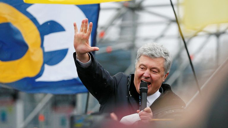 Ukrainian former President Petro Poroshenko speaks to supporters upon arrival at Zhulyany airport in Kyi