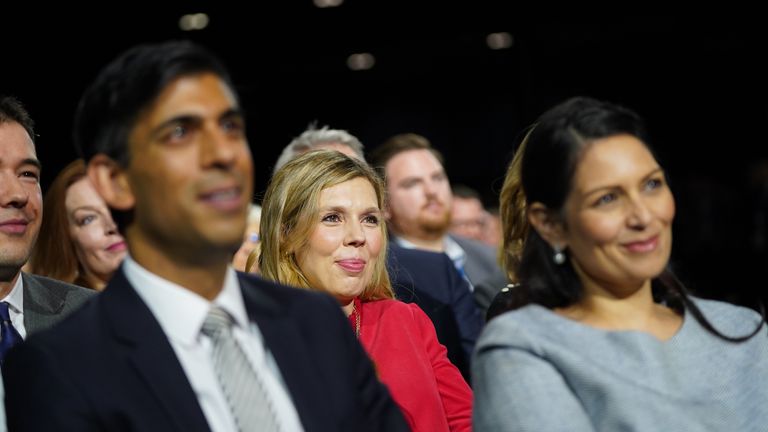 (Left-right) Chancellor of the Exchequer Rishi Sunak, Carrie Johnson and Home Secretary Priti Patel watch as Prime Minister Boris Johnson delivers his keynote speech at the Conservative Party Conference in Manchester. Picture date: Wednesday October 6, 2021.
