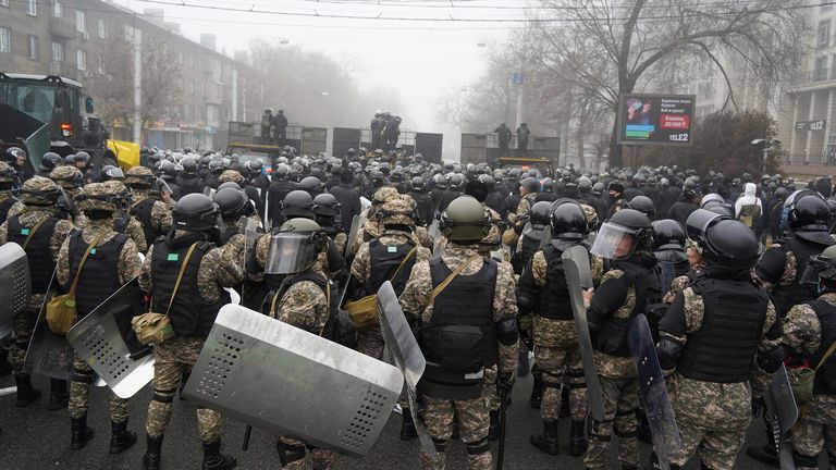 Riot police block a street to prevent protesters during a protest in Almaty, Kazakhstan, on Wednesday, January 5, 2022. Protesters condemning the doubling of liquefied gas prices have clashed with police in Kazakhstan's largest city and held protests for approx. .  a dozen other cities in the country.  (AP Photo / Vladimir Tretyakov)