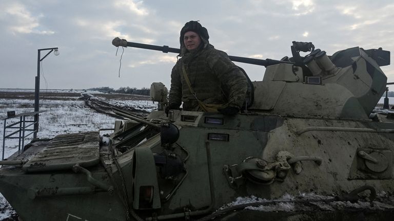 A Russian army service member is seen on an armoured personnel carrier BTR-82 during drills at the Kuzminsky range in the southern Rostov region, Russia January 26, 2022. REUTERS/Sergey Pivovarov/File Photo