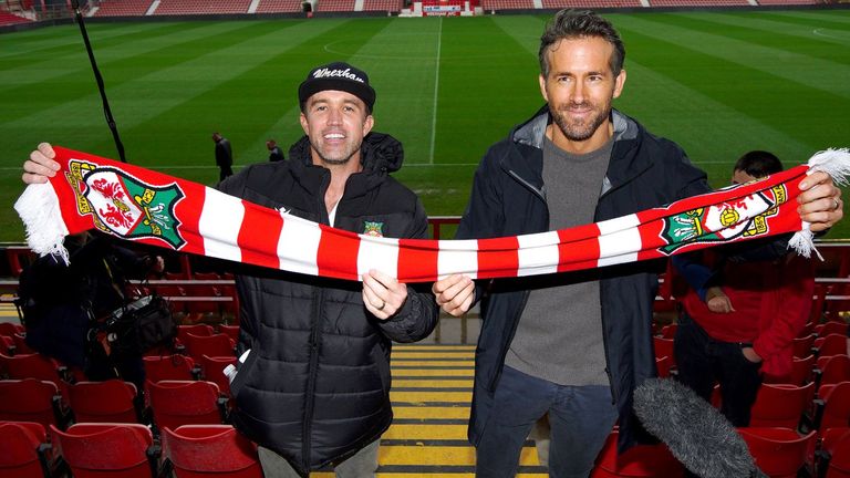 Co-chairmen Ryan Reynolds and Rob McElhenney pose for pictures at Wrexham AFC in October last year