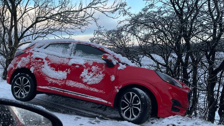 A car stuck in the snow on Gartloch Road in Glasgow, Scotland. Pic: Donald Wilson