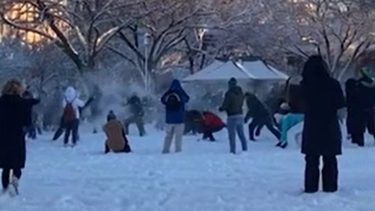 A crowd of people near the Capitol gathered to launch a few snowballs at each other as temperatures dropped and the snowpack grew.