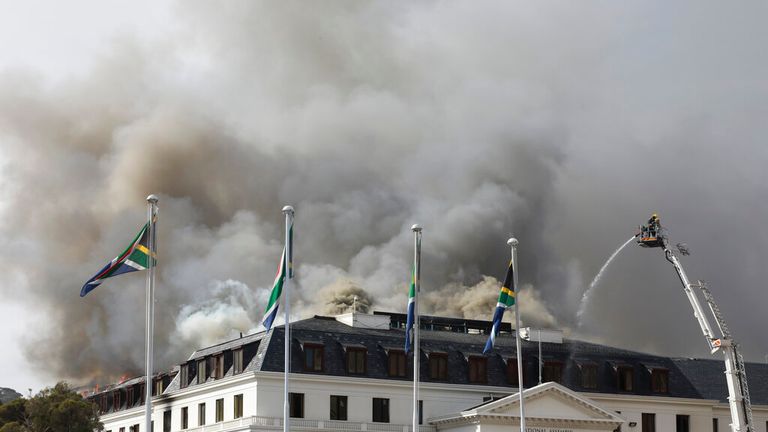 A second cloud of smoke erupted from the parliament building on Monday. Pic: AP