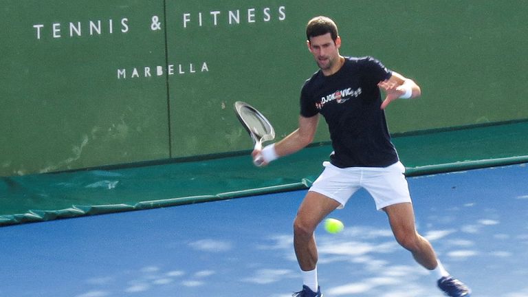Serbian tennis player Novak Djokovic trains at Puente Romano Tennis Club in Marbella, Spain, January 2, 2022. Picture taken January 2, 2022. KMJ-GTRES/Handout via REUTERS THIS IMAGE HAS BEEN SUPPLIED BY A THIRD PARTY.
