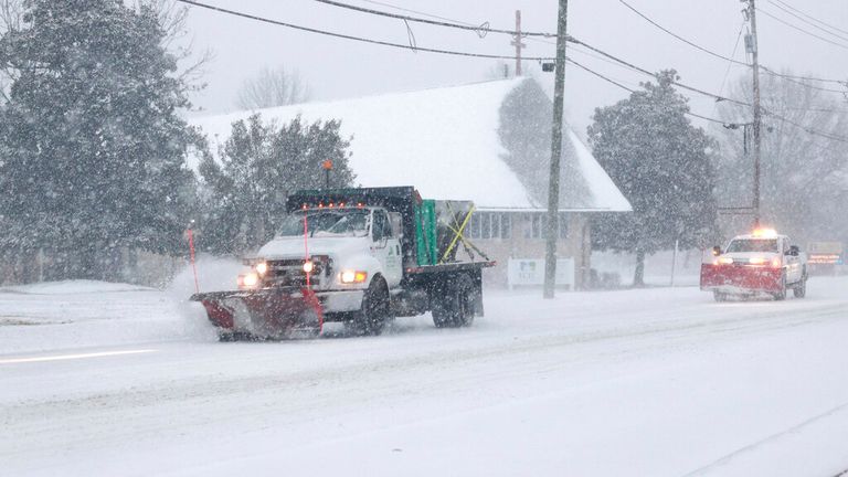 Snow ploughs were out in Alexandria, Virginia, on Sunday. Pic: AP