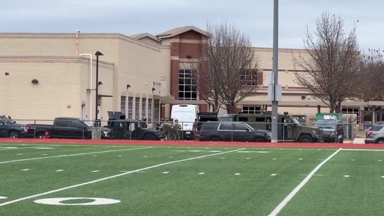 FBI vehicles are pictured surrounding the synagogue complex in Colleyville