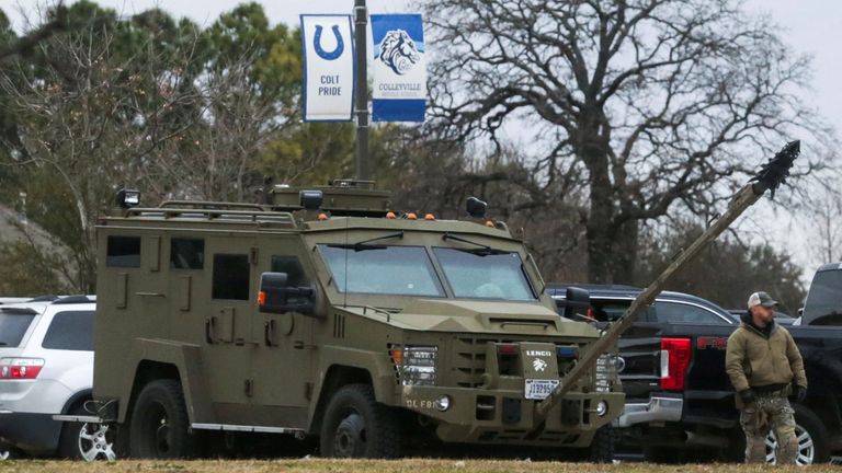 An armed law enforcement vehicle stands by outside the Texas synagogue