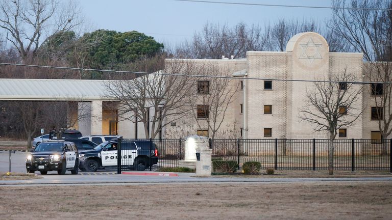 Police stage in front of the Congregation Beth Israel synagogue, Sunday, Jan. 16, 2022, in Colleyville, Texas. A man held hostages for more than 10 hours Saturday inside the temple. The hostages were able to escape and the hostage taker was killed. FBI Special Agent in Charge Matt DeSarno said a team would investigate ...the shooting incident.... (AP Photo/Brandon Wade) 