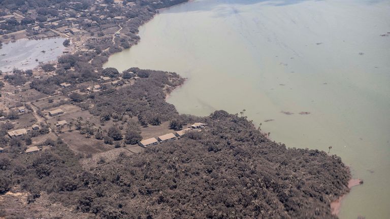 Ash covered homes in Nomuka in Tonga as seen from a New Zealand Defence Force P-3K2 Orion surveillance flight