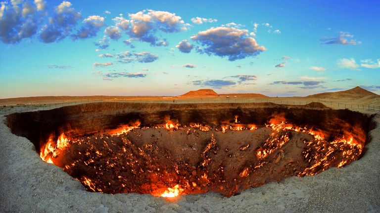The crater fire named "Gates of Hell" is seen near Darvaza, Turkmenistan, Saturday, July 11, 2020. The president of Turkmenistan is calling for an end to one of the country&#39;s most notable but infernal sights — the blazing desert natural gas crater widely referred to as the “Gates of Hell.” The crater, about 260 kilometers (160 miles) north of the capital Ashgabat, has been on fire for decades and is a popular sight for the small number of tourists who come to Turkmenistan, which is difficult to 