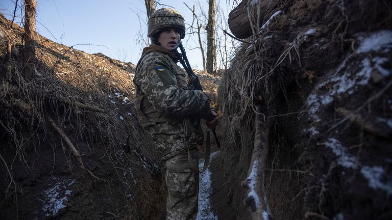 A Ukrainian soldier stands in the trench on the line of separation from pro-Russian rebels, in Mariupol, Donetsk region, Ukraine, Thursday, Jan. 20, 2022.  
PIC:AP