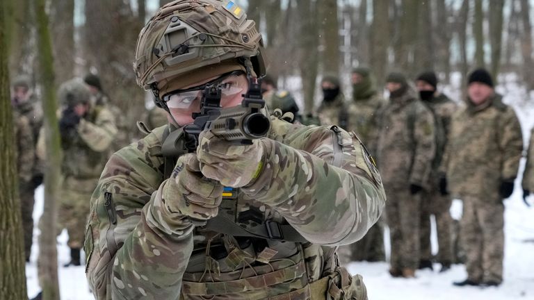 Members of Ukraine&#39;s territorial defence forces train in a city park in Kyiv. Pic: AP