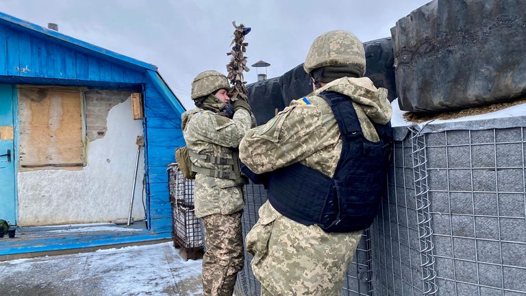 Ukrainian soldiers taking a rooftop position