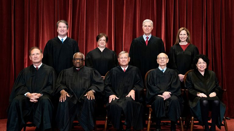 FILE PHOTO: Associate Justice Brett Kavanaugh, Associate Justice Elena Kagan, Associate Justice Neil Gorsuch, Associate Justice Amy Coney Barrett, Associate Justice Samuel Alito, Associate Justice Clarence Thomas, Chief Justice John Roberts, Associate Justice Stephen Breyer and Associate Justice Sonia Sotomayor pose for a group photo at the Supreme Court in Washington, U.S., April 23, 2021. Erin Schaff/Pool via REUTERS/File Photo
