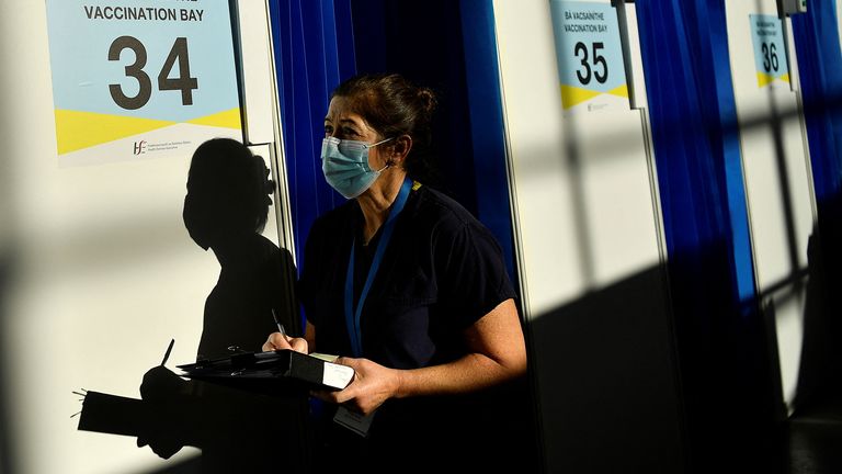 A nurse checks booster stocks at a vaccination centre in Dublin