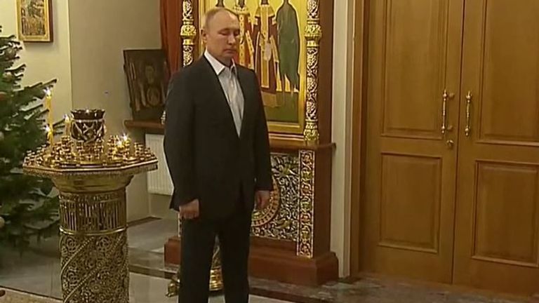 Vladimir Putin attending mass alone at his residence