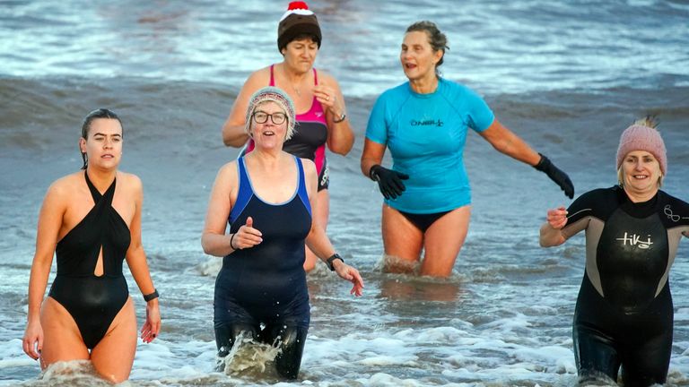 Swimmers take part in the New Year&#39;s Day swim at Derby Pool, New Brighton, Wirral