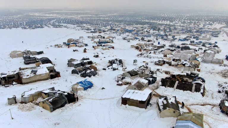 A snow covered camp for internally displaced people is seen in the Aleppo countryside, Syria January 23, 2022. Picture taken January 23, 2022. Picture taken with drone. REUTERS/Mahmoud Hassano
