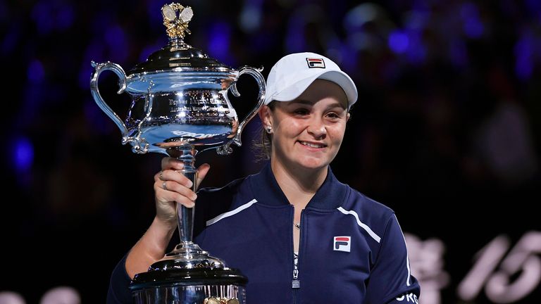 Ashleigh Barty of Australia holds the Daphne Akhurst Memorial Cup aloft after defeating Danielle Collins of the U.S., in the women&#39;s singles final at the Australian Open tennis championships in Saturday, Jan. 29, 2022, in Melbourne, Australia. (AP Photo/Andy Brownbill)