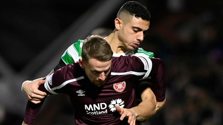 EDINBURGH, SCOTLAND - JANUARY 26: Hearts&#39; Stephen Kingsley (left) and Celtic&#39;s Giorgos Giakoumakis during a cinch Premiership match between Hearts and Celtic at Tynecastle Park , on January 26, 2022, in Edinburgh, Scotland. (Photo by Rob Casey / SNS Group)