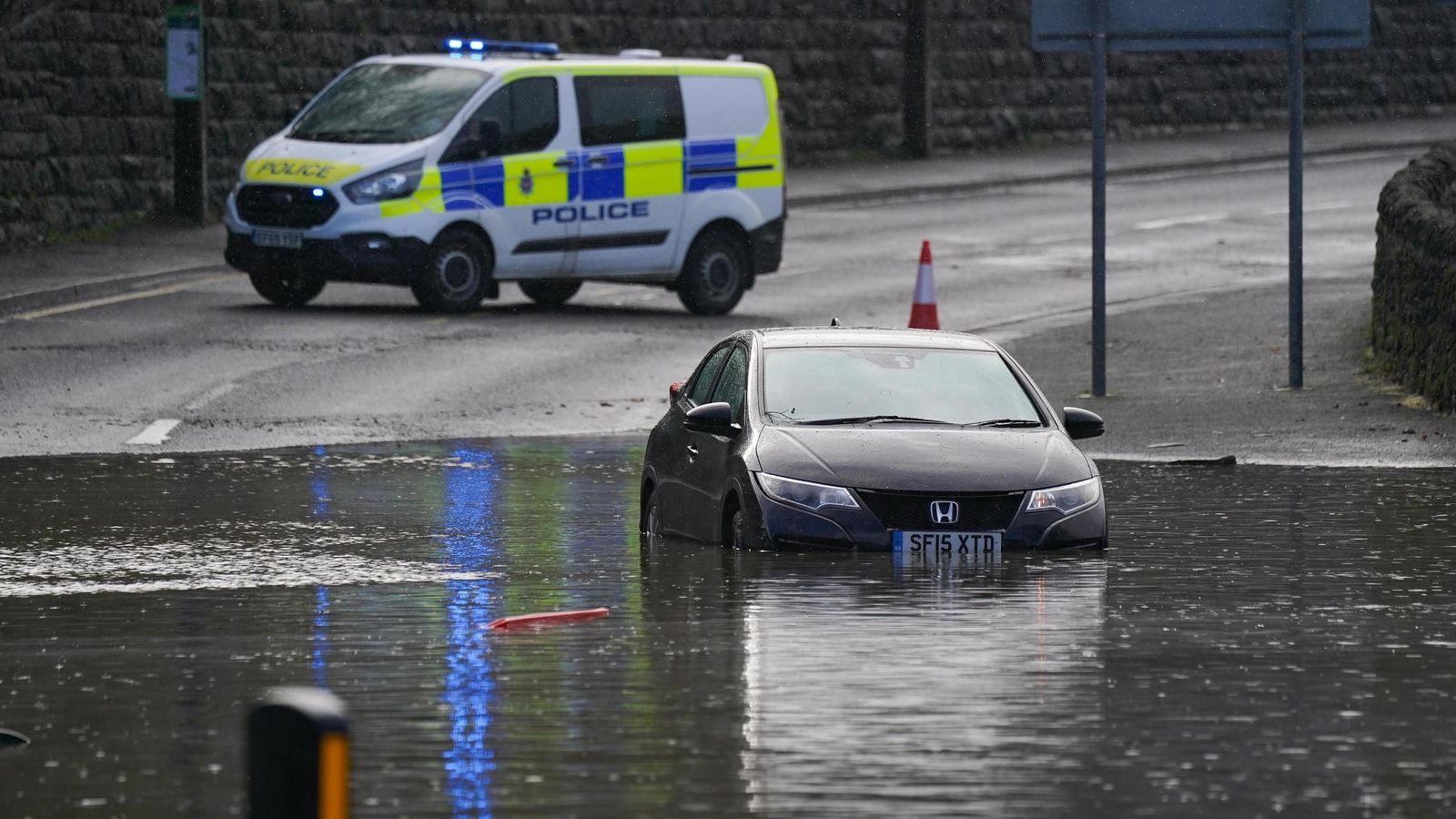 UK weather Flash flooding, travel chaos, thousands without power and