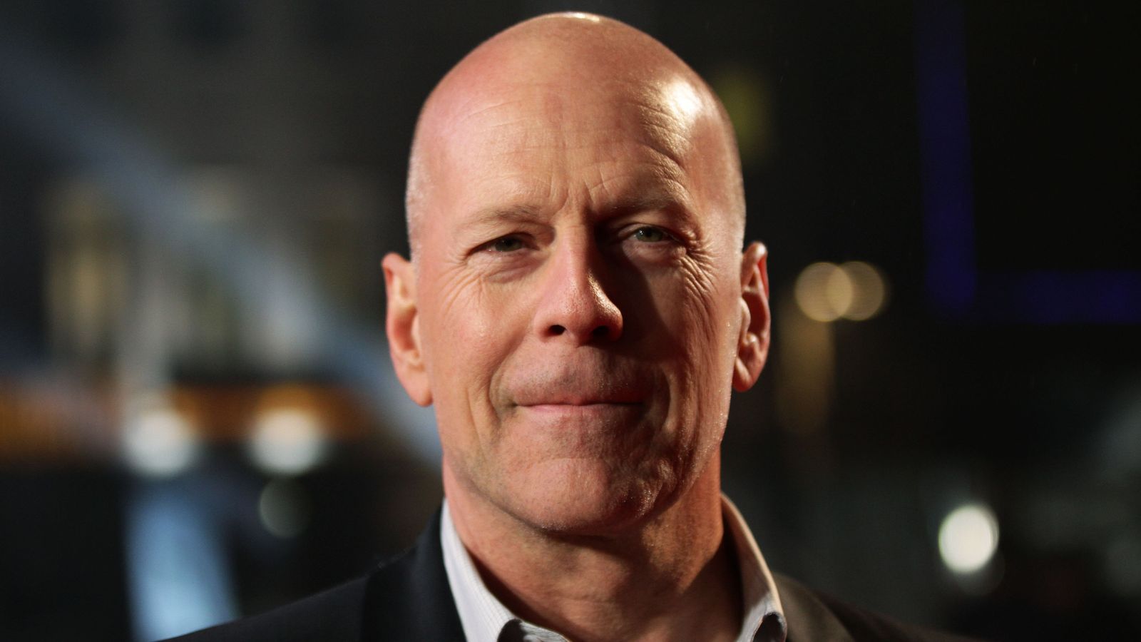 Bruce Willis's wife asks paparazzi to 'keep your space' and not 'yell' at him after dementia diagnosis