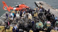 Packages of cocaine and marijuana seized at sea are seen on deck before being unloaded from US Coast Guard Cutter James in Port Everglades, in Fort Lauderdale, Florida