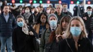 LONDON, UNITED KINGDOM - FEBRUARY 02, 2022: Commuters, some continuing to wear face masks, arrive at Waterloo station during morning rush hour on February 02, 2022 in London, England. The passenger numbers across the transport network have been increasing since relaxation of Covid-19 measures last week as workers and shoppers return to city centres. Yesterday, the UK recorded 112,458 new cases as reinfections were included in the official statistics for the first time.

