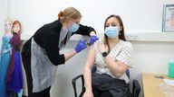 Holly Fox (right) receives a Moderna Omicron COVID-19 booster vaccine in a clinical study at St George&#39;s, University of London, in Tooting, south west London. Picture date: Thursday February 17, 2022.
