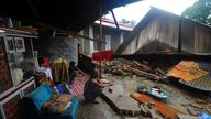 Residents inspect the ruin of their badly damaged house after an earthquake in West Pasaman district, West Sumatra, Indonesia,  (AP Photo/Ardhy Fernando)