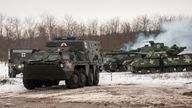 Ukrainian armored vehicles drive during military drills close to Kharkiv, Ukraine, Thursday, Feb. 10, 2022. Britain's top diplomat has urged Russia to take the path of diplomacy even as thousands of Russian troops engaged in sweeping maneuvers in Belarus as part of a military buildup near Ukraine. (AP Photo/Andrew Marienko)