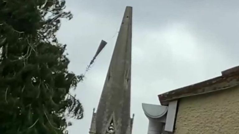 Spire falls off as Storm Eunice batters UK