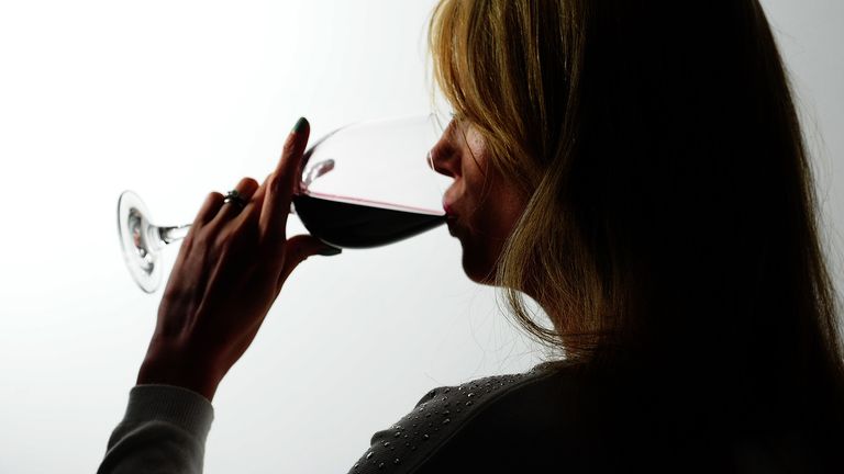 File photo dated 22/04/14 of a woman drinking alcohol, as the Royal Society for Public Health (RSPH) has suggested that explicit cigarette-style warnings of the link between drinking and health conditions such as bowel and breast cancer should appear on the labels of alcoholic drinks.