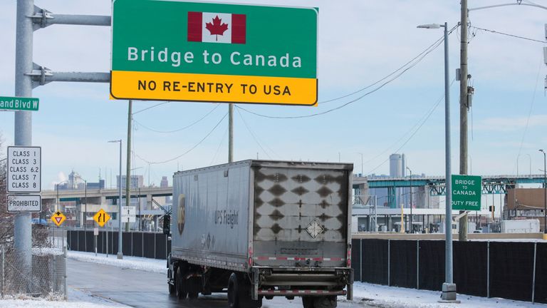 A commercial truck enters the entrance ramp to the Ambassador Bridge to Canada in Detroit, Michigan, U.S., February 14, 2022. REUTERS/Rebecca Cook
