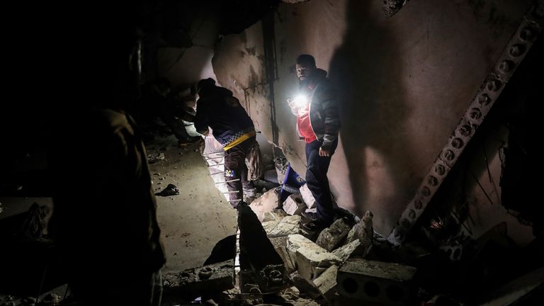 03 February 2022, Syria, Atmeh: People inspect the damage in a house following a raid by the US-led International Coalition in the town of Atmeh. At least 13 people, including four children, were killed in the counterterrorism operation mounted early Thursday by US special forces. Photo by: Anas Alkharboutli/picture-alliance/dpa/AP Images
PIC:Ap

