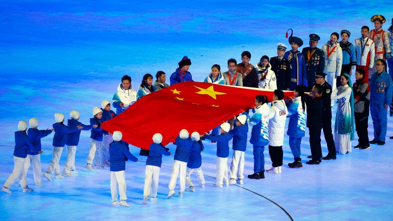 2022 Beijing Olympics - Opening Ceremony - National Stadium, Beijing, China - February 4, 2022..The Chinese flag is carried by perfomers during the opening ceremony. REUTERS/Thomas Peter