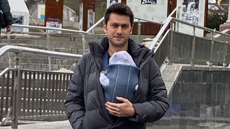 Undated handout photo of Ben Garratt with baby Raphael. A British couple living in Ukraine have described the 