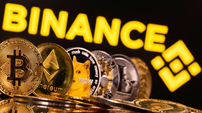 FILE PHOTO: Representations of cryptocurrencies Bitcoin, Ethereum, DogeCoin, Ripple, and Litecoin are seen in front of a displayed Binance logo in this illustration taken, June 28, 2021. REUTERS/Dado Ruvic/Illustration/File Photo
