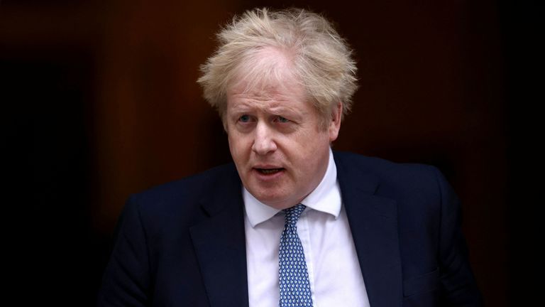 British Prime Minister Boris Johnson walks outside Downing Street 